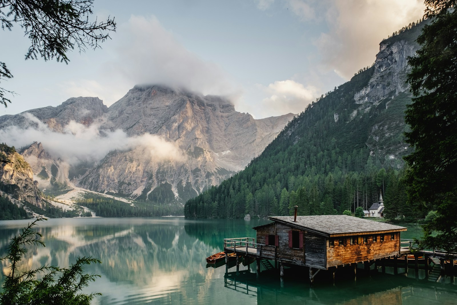 Alpine lake and peaks in an illustrated scouting frame
